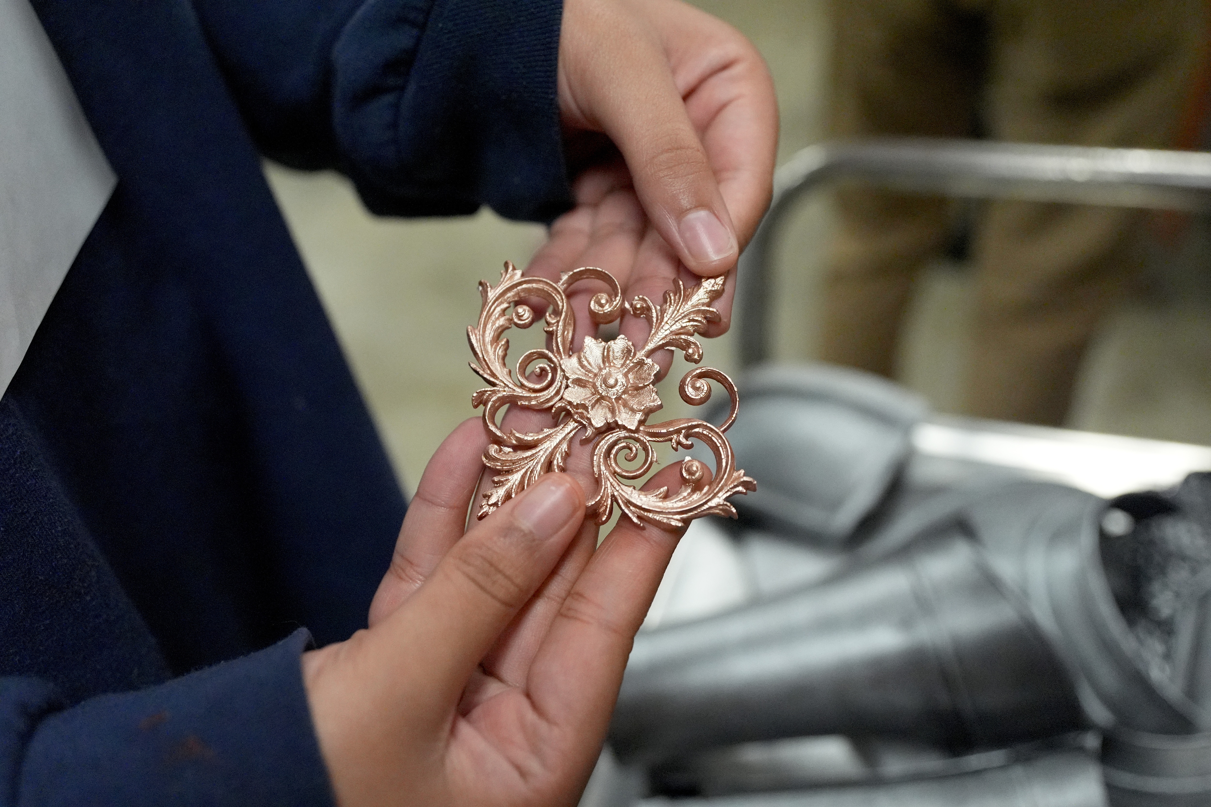 Aleah Rhodes, 16, sophomore at Haywood High School in Brownsville, Tenn., shows one of the ornaments she and others designed, constructed and painted in the Ford Future Builders Lab for an upcoming student play based on the Disney movie “Frozen,” in the school’s Ford Future Builders Lab April 14, 2026. The lab is one of several that opened this academic year in West Tennessee to assist K-12 students and their teachers to learn about tools of skilled trades, including laser cutting, 3D printing and coding. (Rogelio V. Solis for Ford Communications)