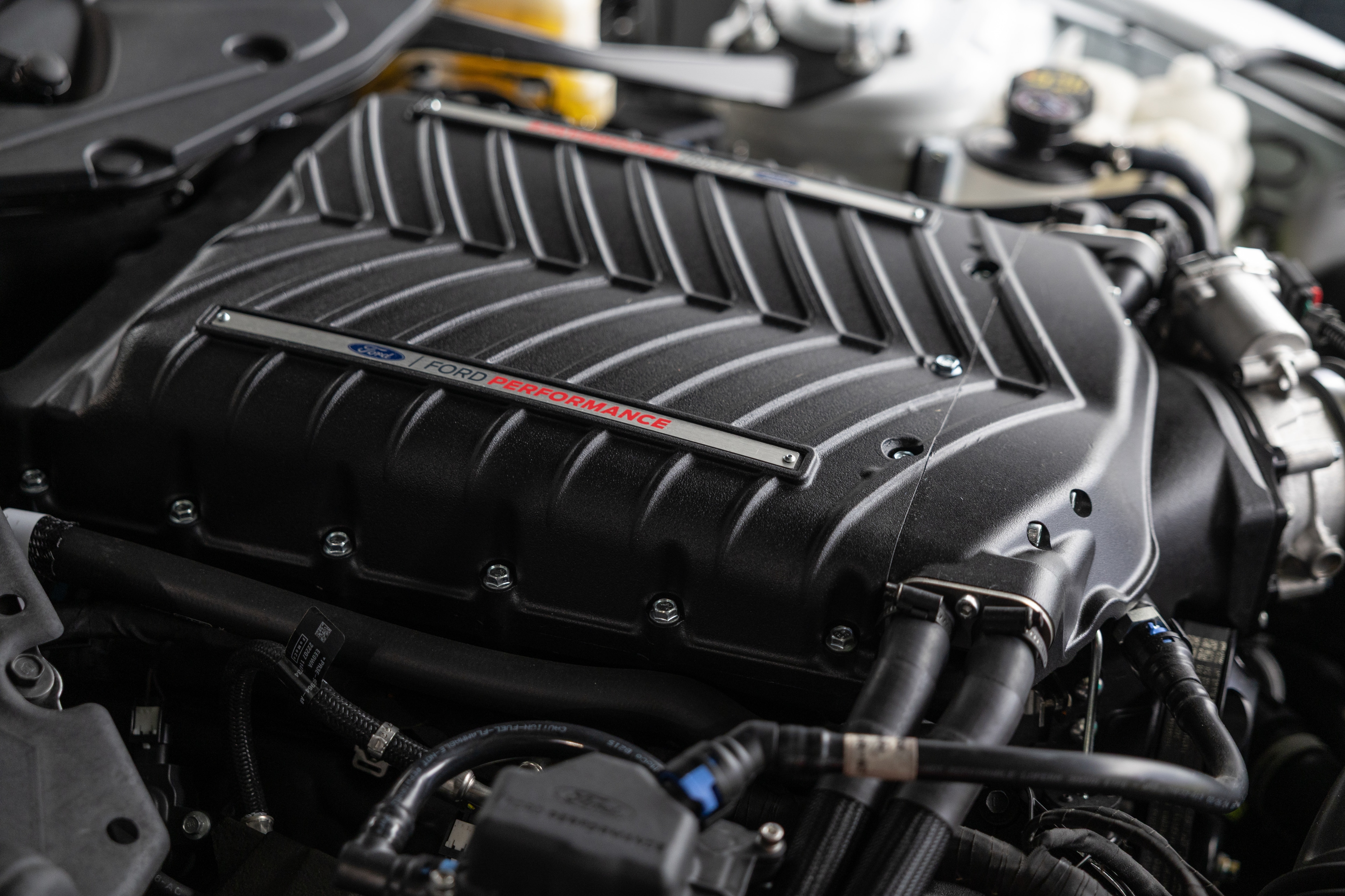 Ford Racing Parts is now offering the V8 Supercharger Kit as a pre-installed, pre-delivery option on all 2026 F-150 and Mustang vehicles with the 5.0-liter V8 engine, including the F-150 Lobo.