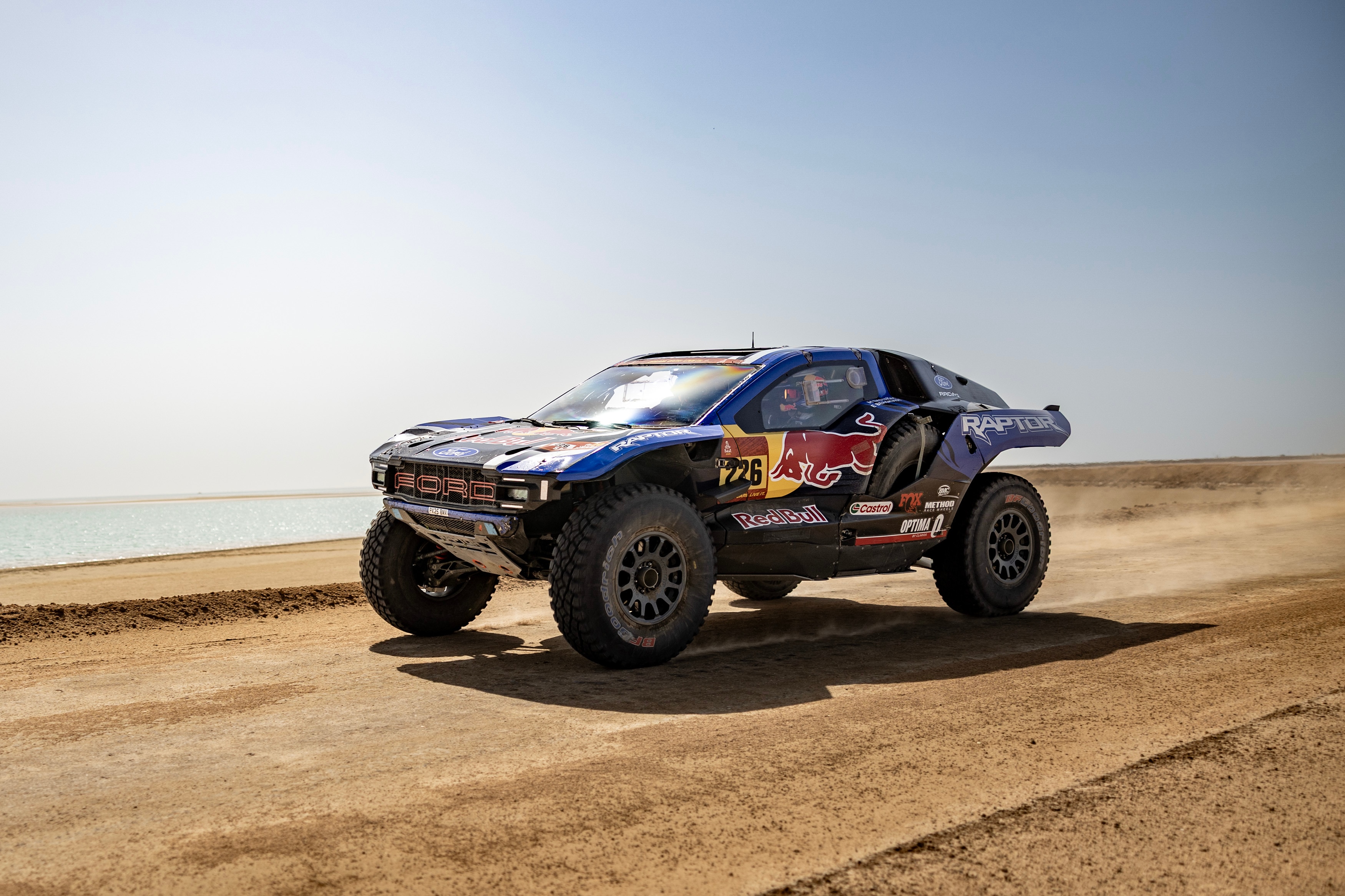 A Ford Raptor T1 driving on the sand at Dakar 2026.