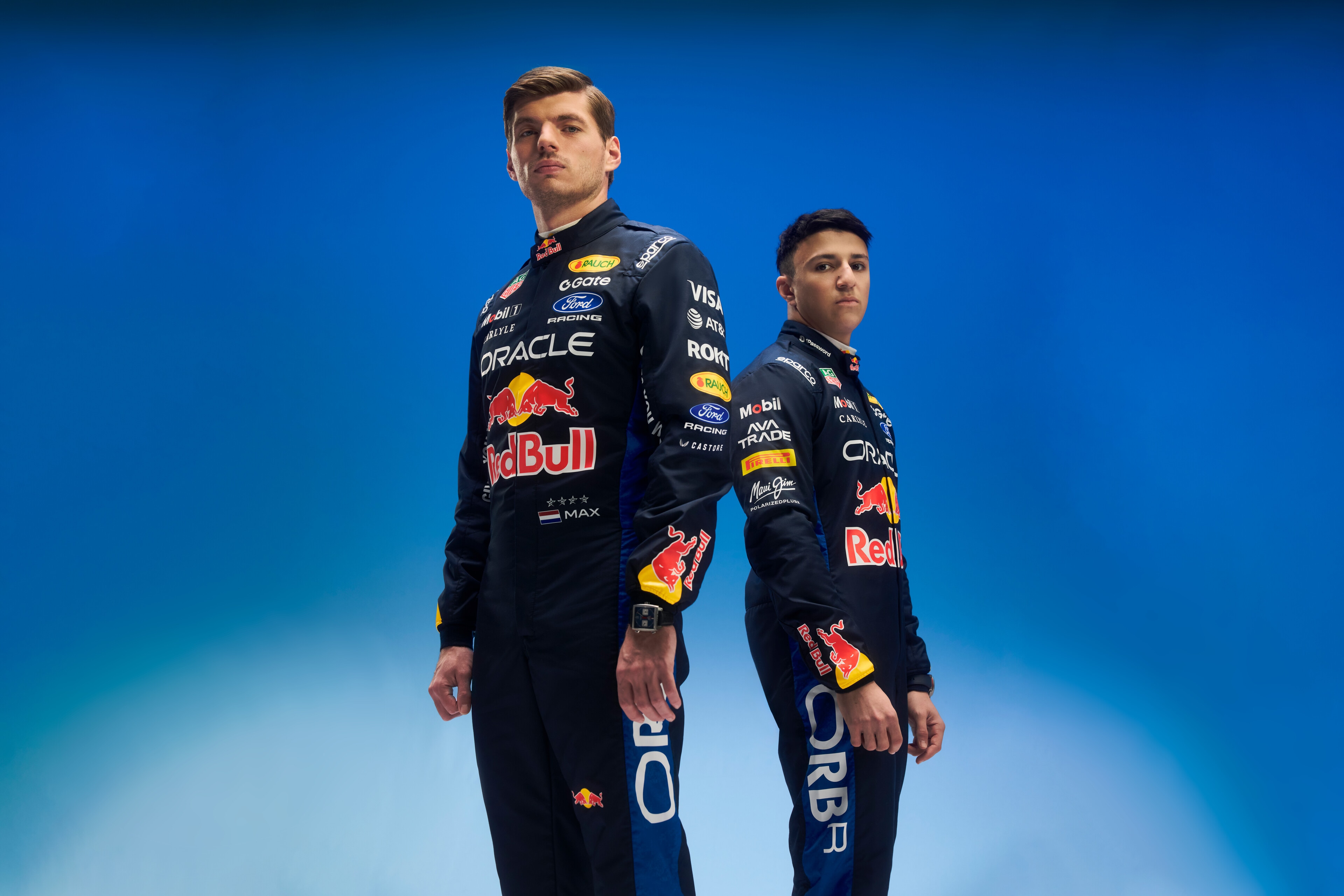 Max Verstappen & Isack Hadjar pose in the 2026 Oracle Red Bull Racing Sparco Race Suits. Khalil Musa/Red Bull Content Pool. Usage for editorial use only. 