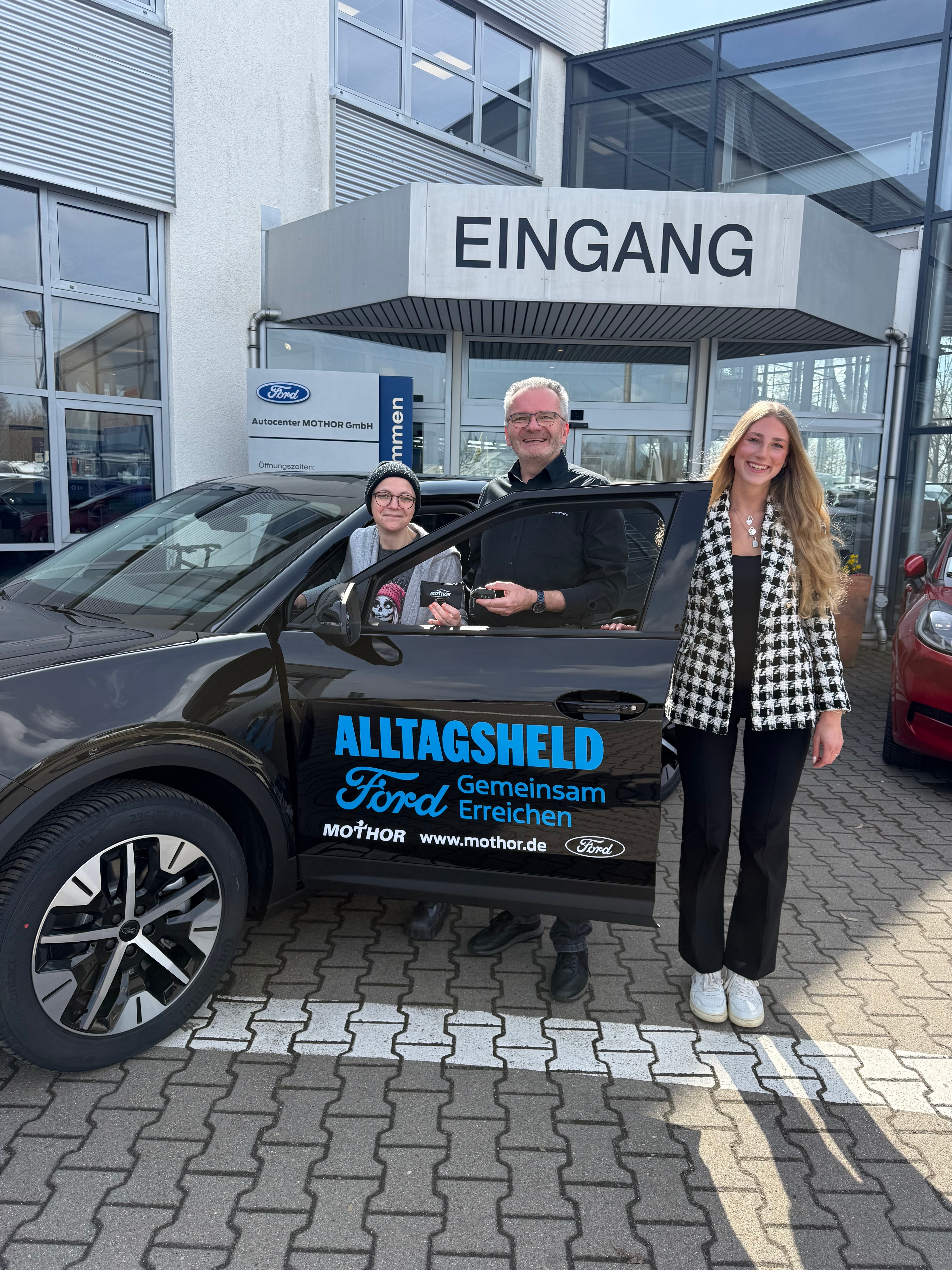 Nancy Petsch, founder of Team Kleiderursel, receives her all-electric Ford Explorer® SUV.