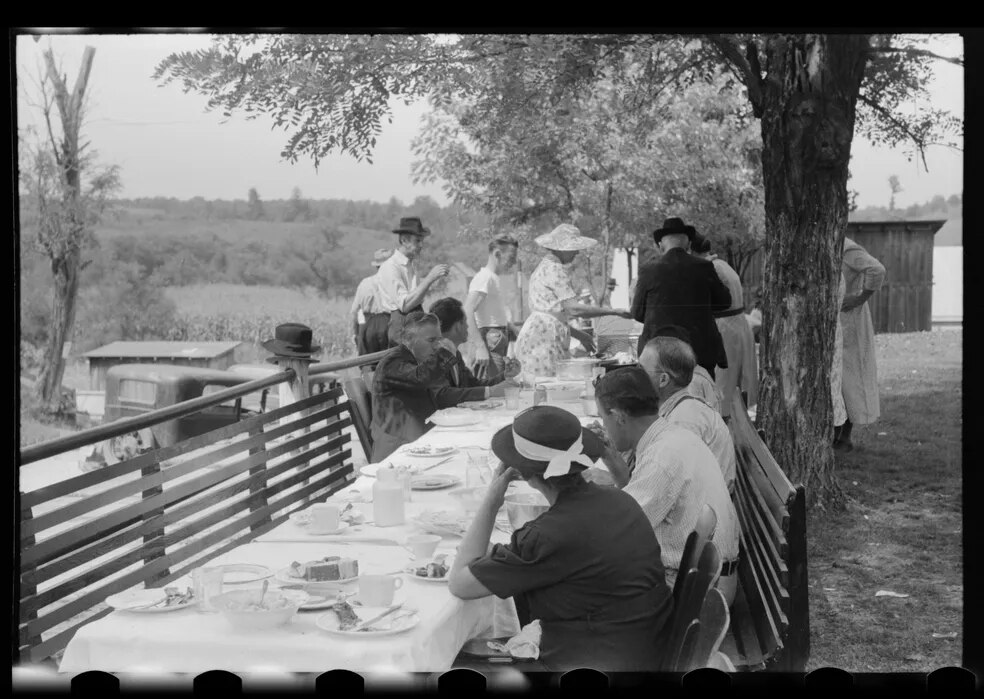 Marion Post Wolcott, photographer, 1940. Farmers at benefit supper.