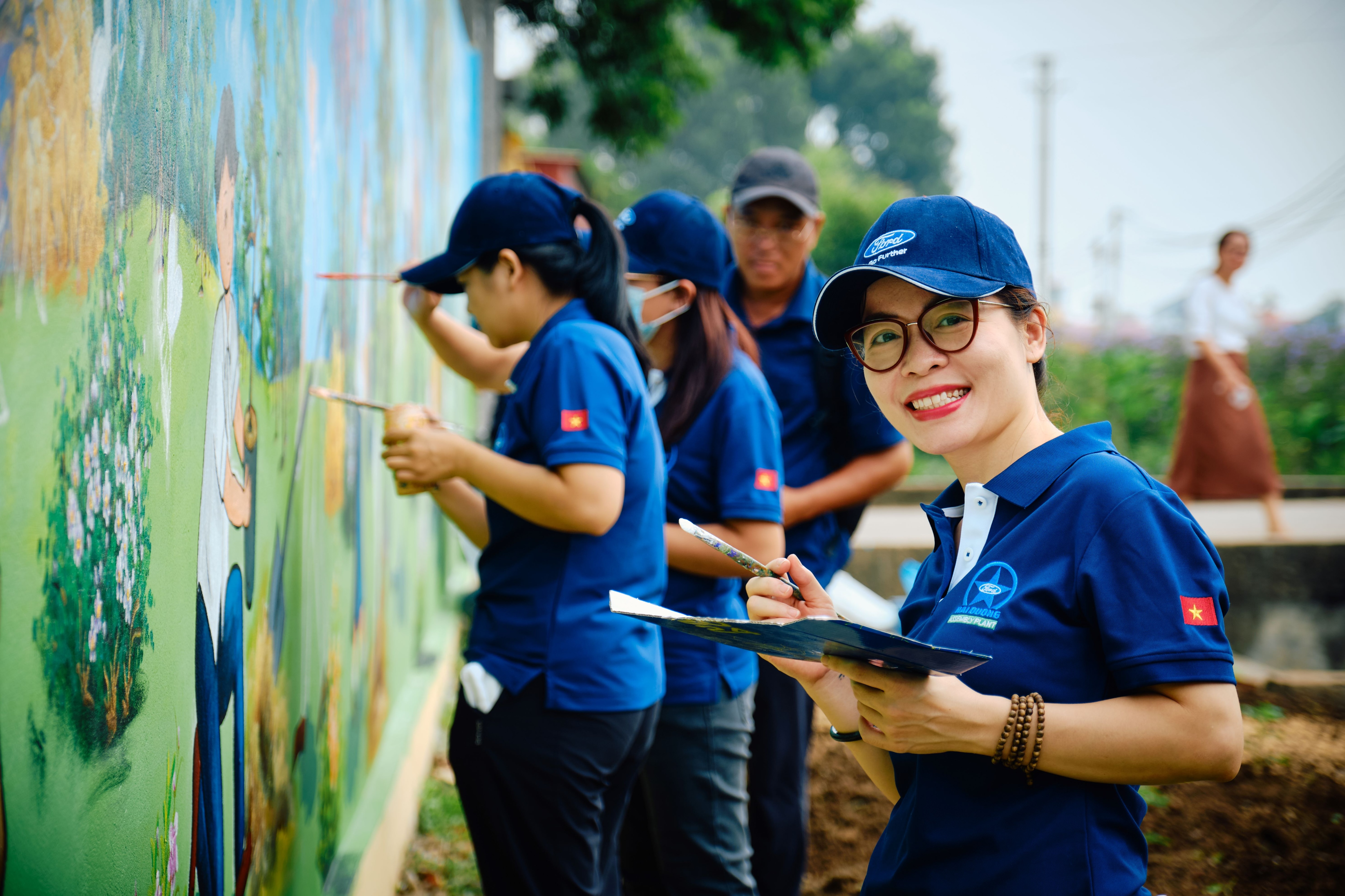 Ford employees and dealers unite for Global Caring Month, driving grassroots change with volunteer projects and community grants worldwide.