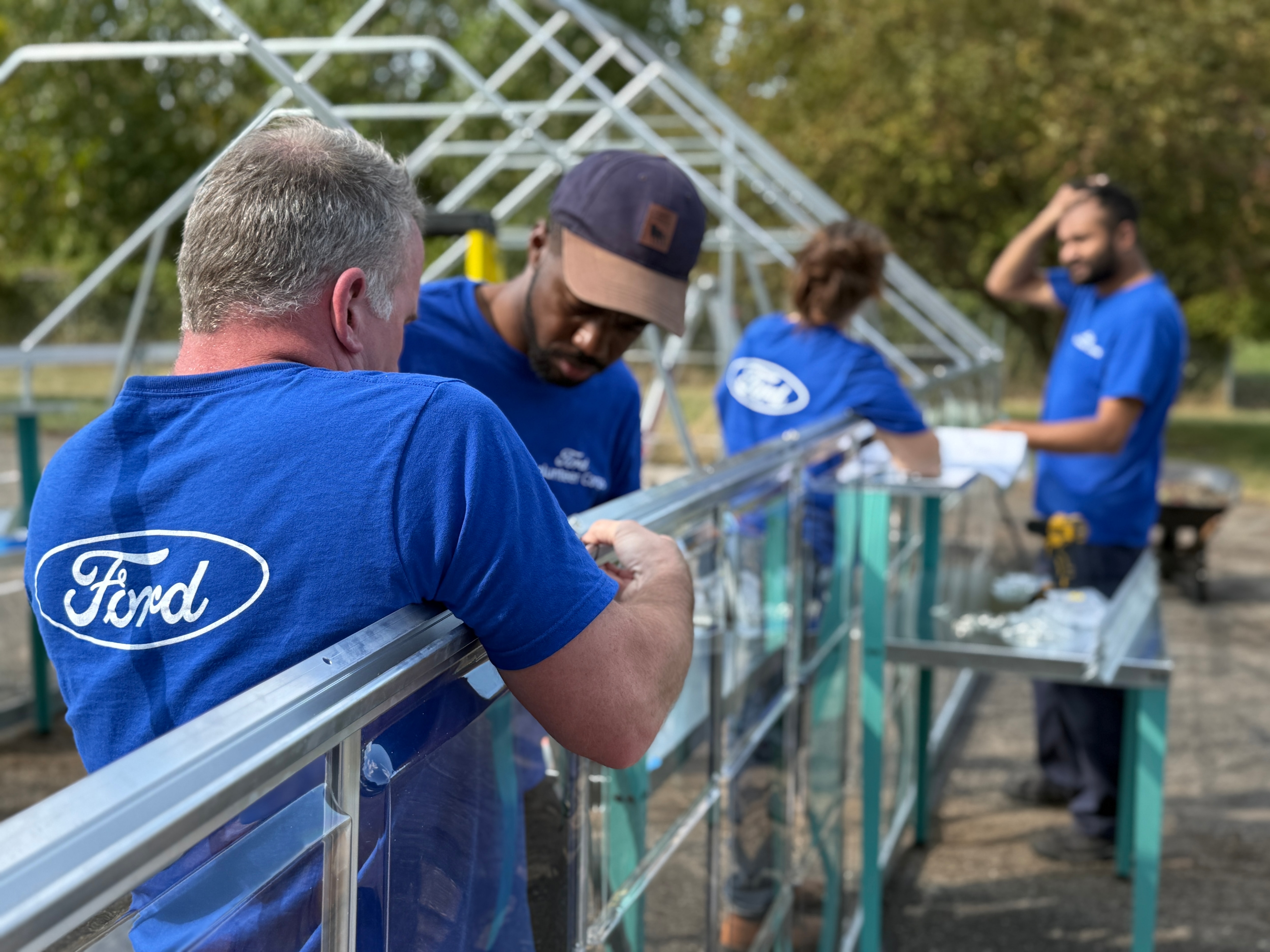 Ford employees and dealers unite for Global Caring Month, driving grassroots change with volunteer projects and community grants worldwide.