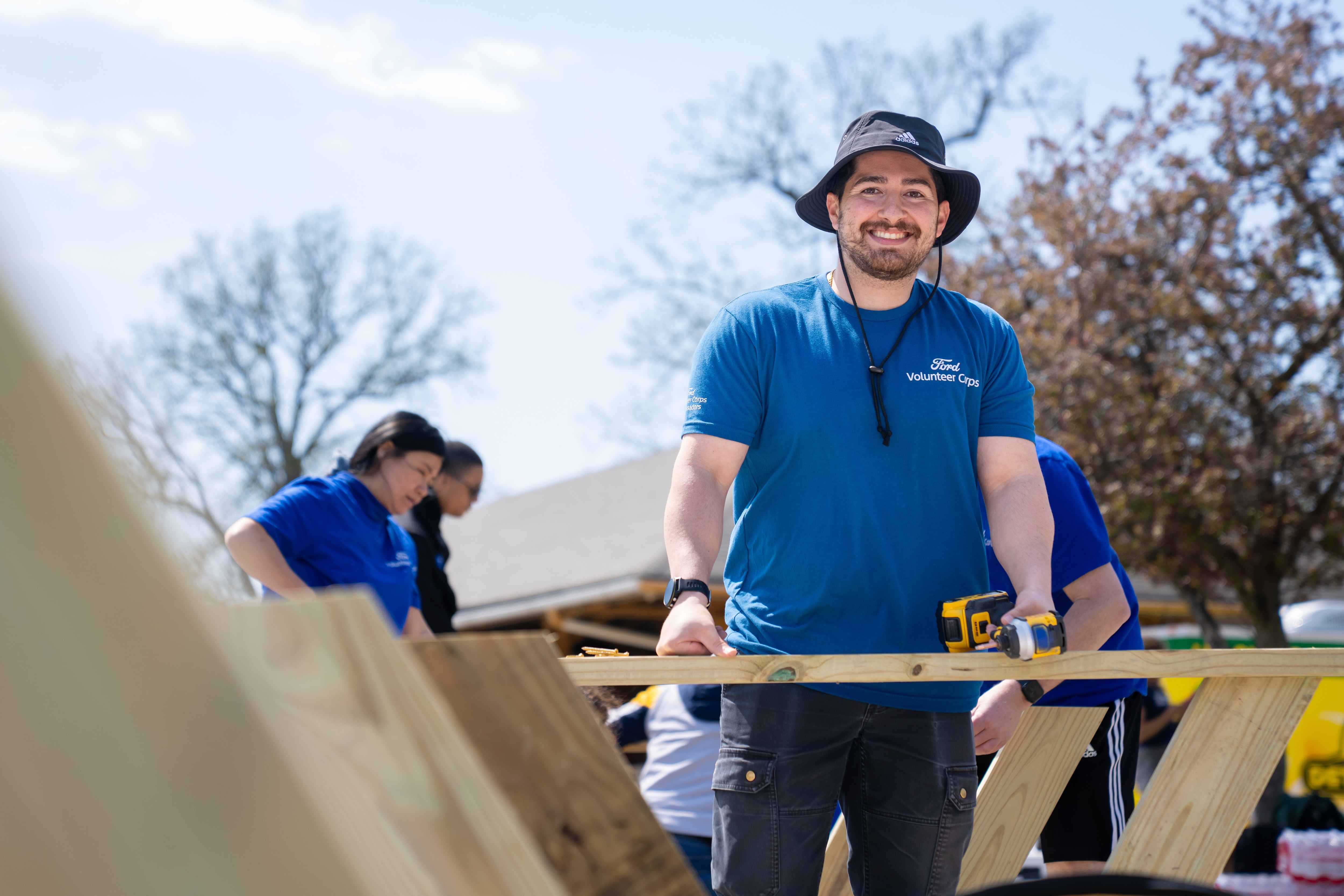 Ford employees and dealers unite for Global Caring Month, driving grassroots change with volunteer projects and community grants worldwide.