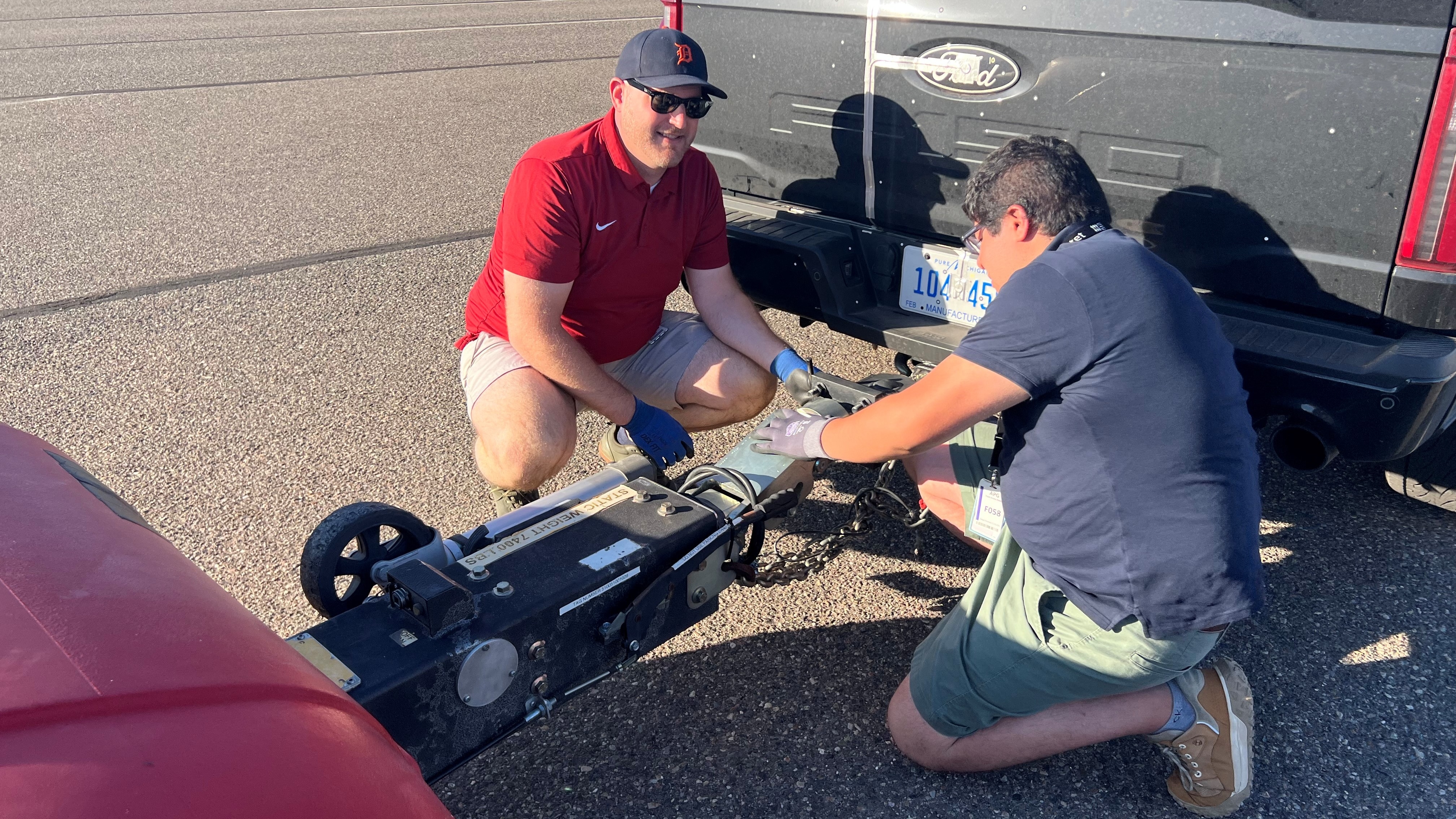 Stephen Kluck, Core Thermal Systems Engineer, and Arturo Garcia, Senior Thermal Systems Engineer, hooking up a tow dynamometer for testing at Ford's Arizona Proving Ground.