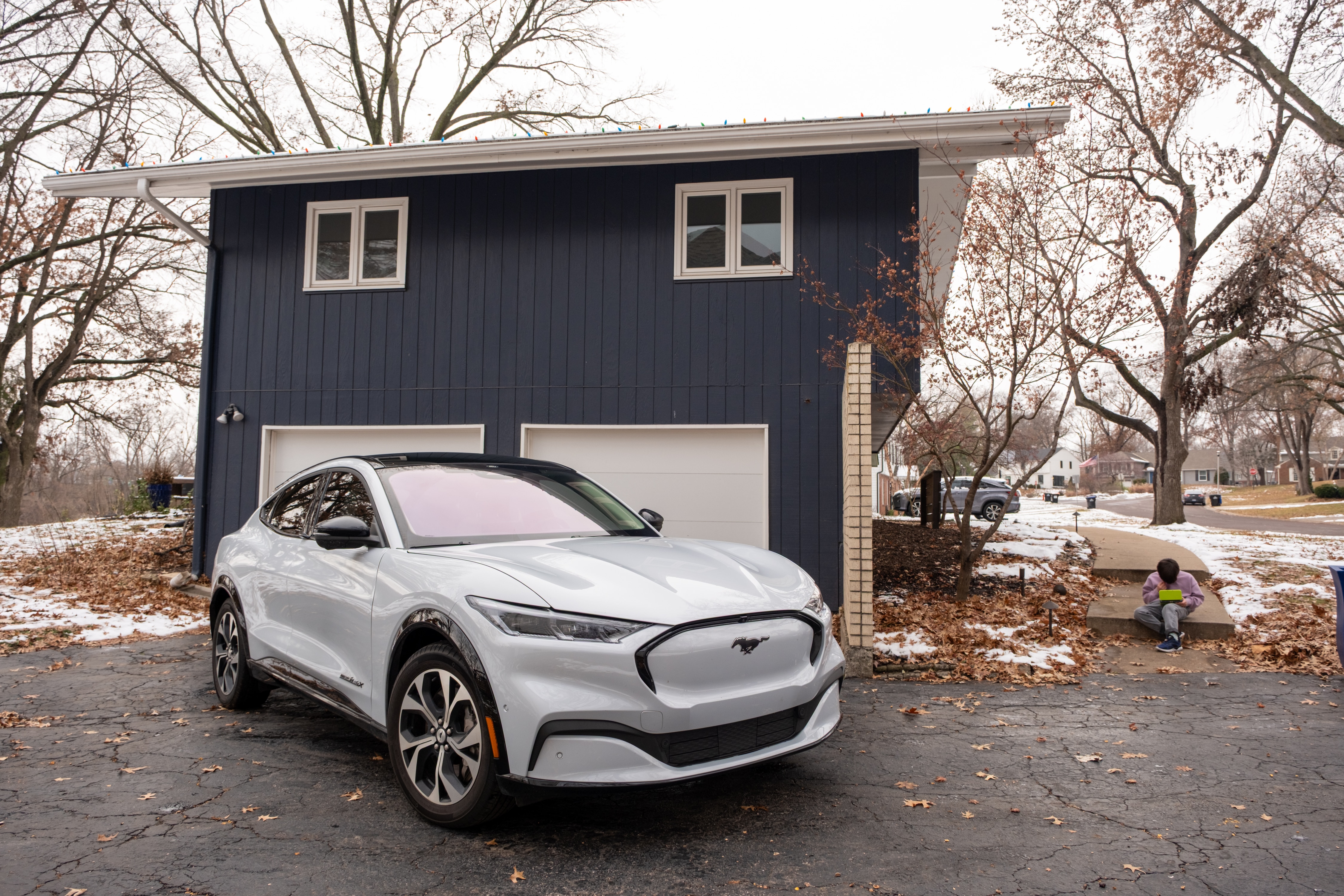 Clayton's Mustang Mach-E parked in front of the garage.