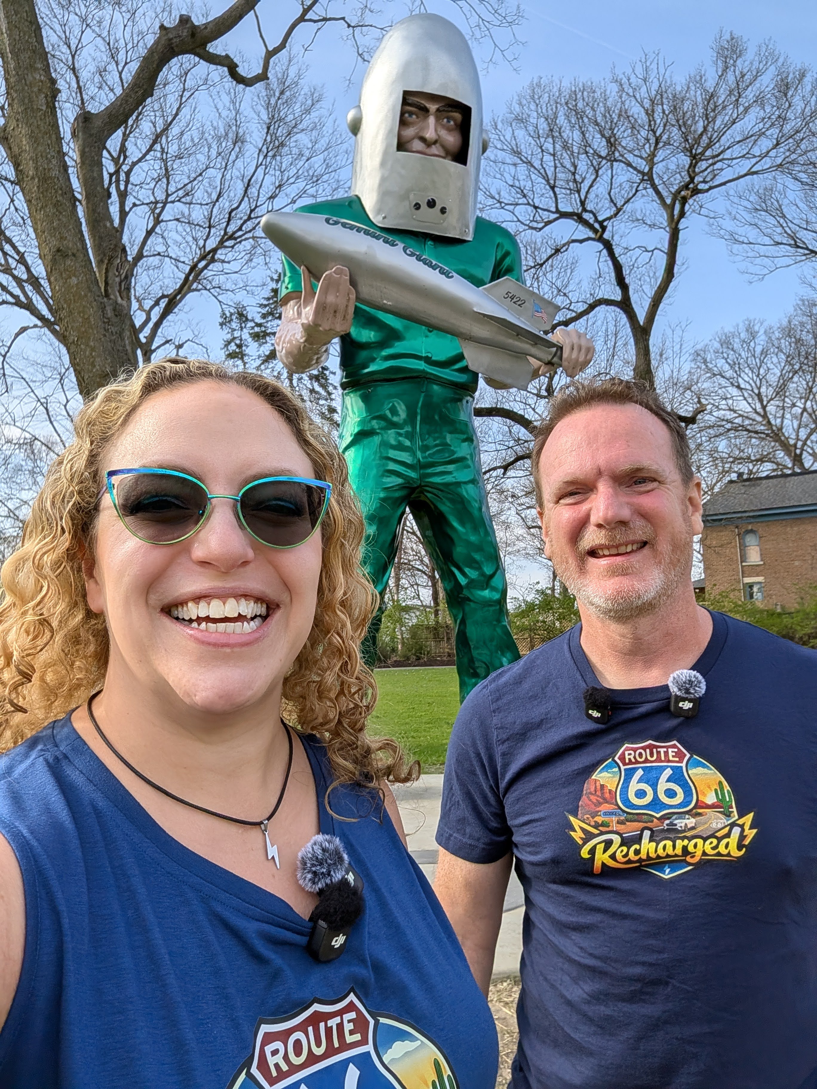 The Electric Duo poses with the Gemini Giant muffler man in Wilmington, Illinois. 