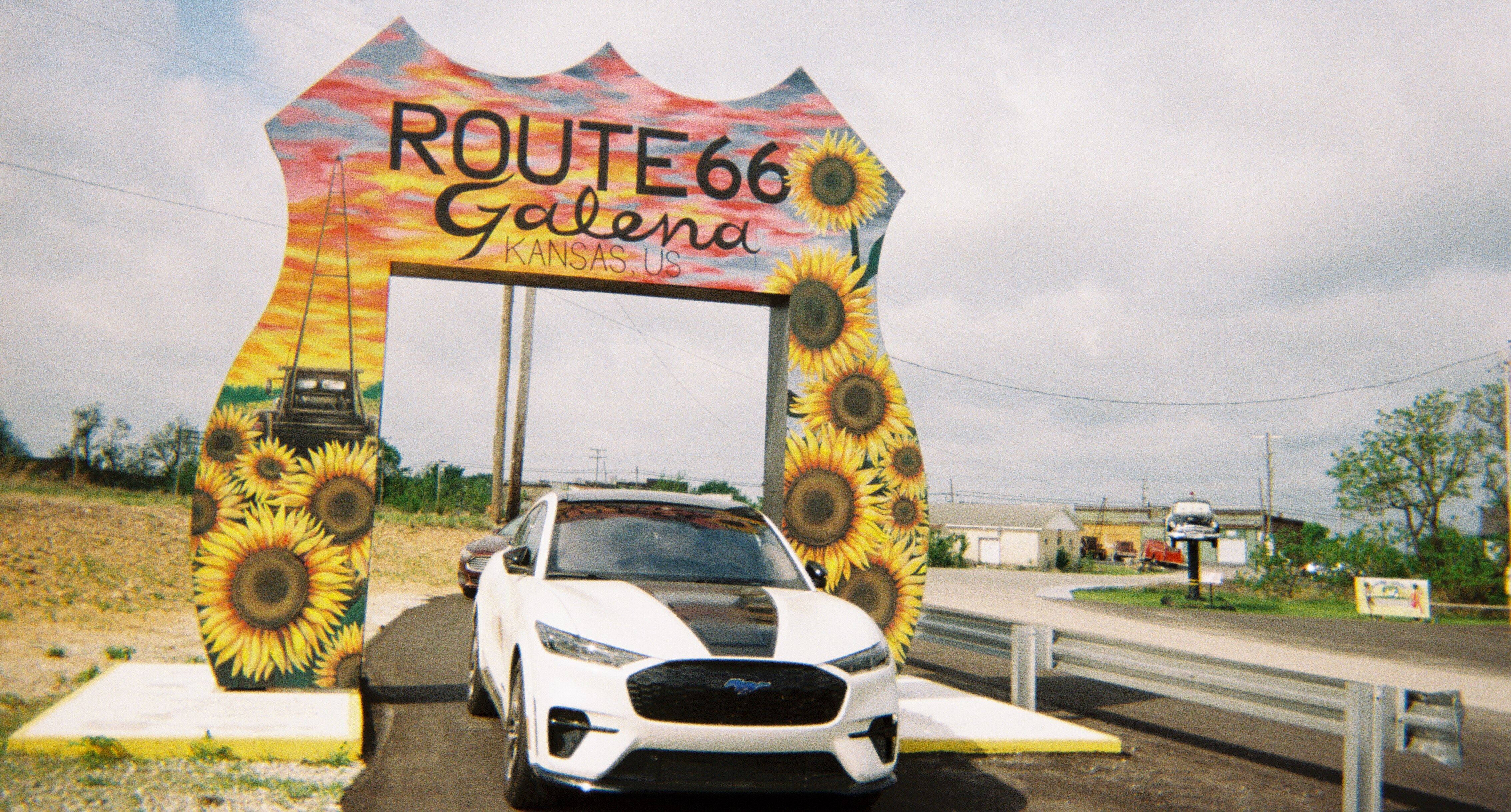 A 16-foot-tall drive-through Route 66 sign painted by Sandra Dawn Pemberton in Galena, Kansas.  