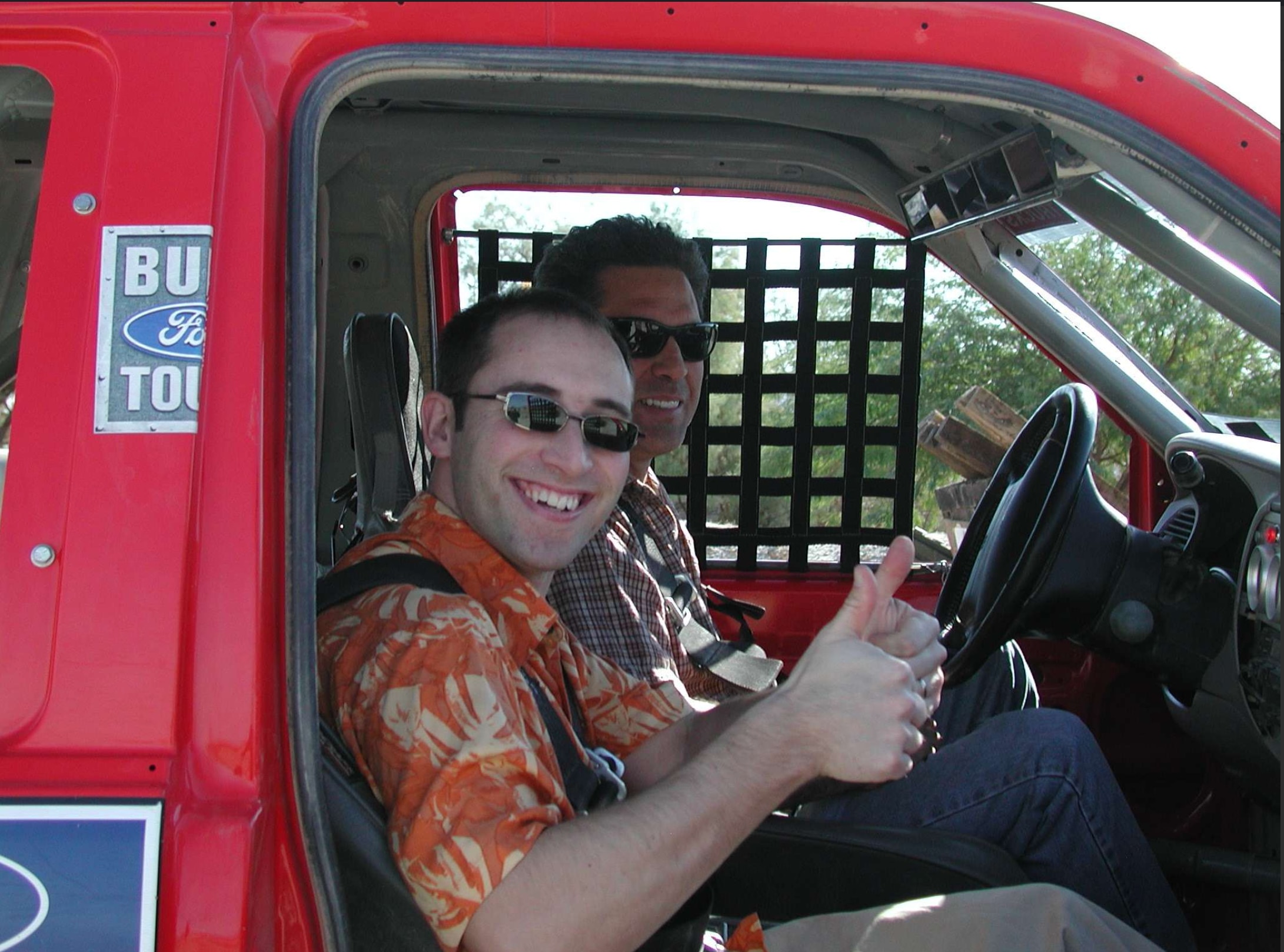 Engineer Tim Smith sits behind the wheel of an early development test truck during field evaluations.