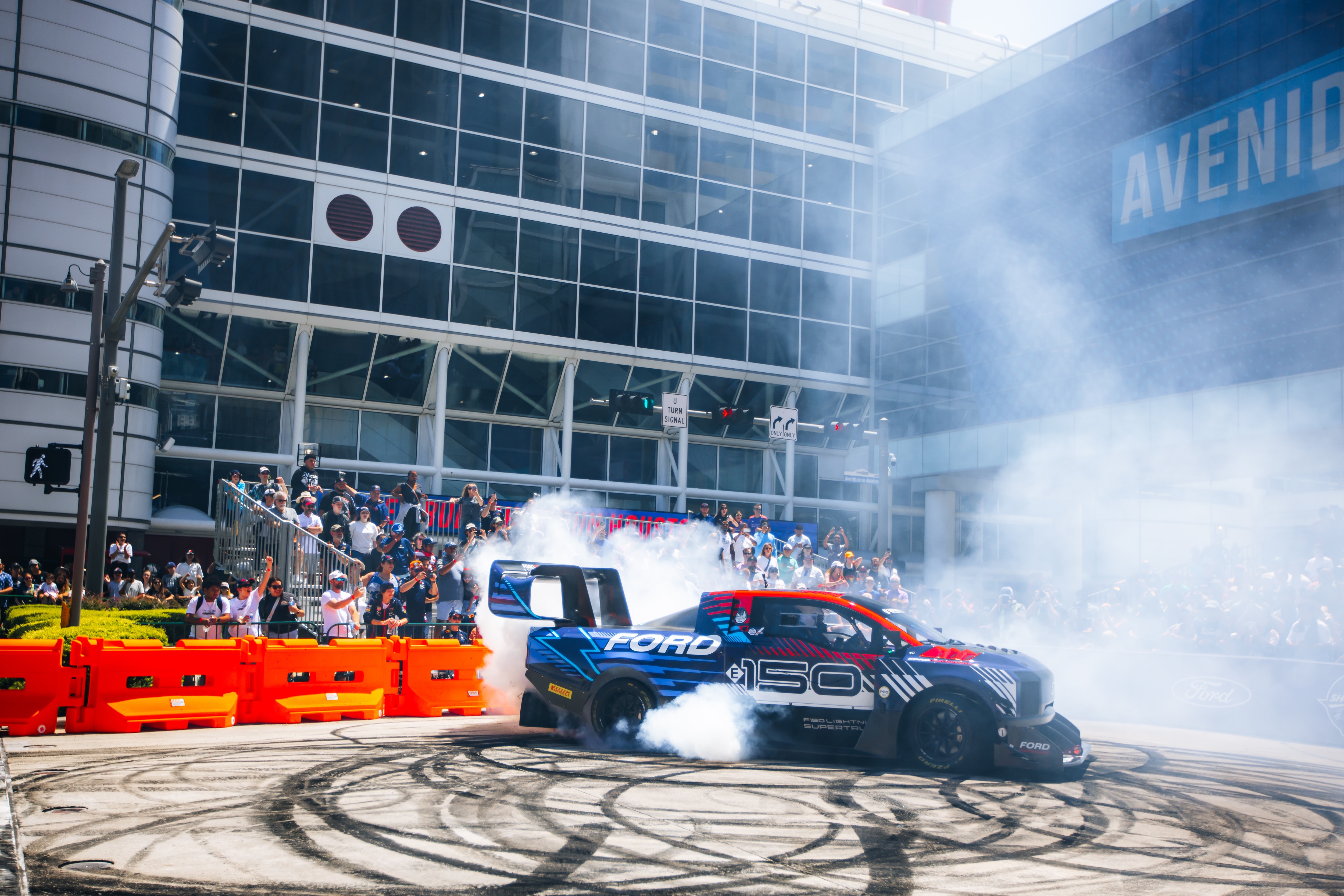 A Ford Red Bull SuperTruck circles a track in Houston.