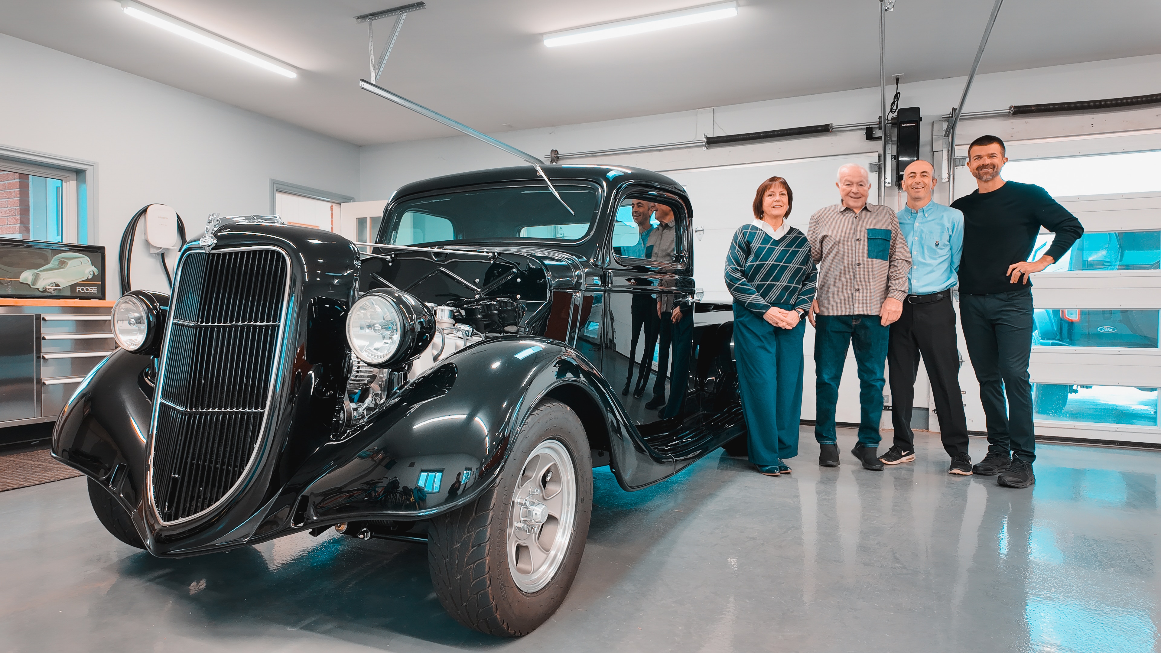 Mary Knapp, Bill Knapp, Ben Makepeace (Mary's son), and James Knapp (Bill's son) with the restored 1936 Ford pickup. Ben and James both work at a Ford dealership operated by relative Ken Knapp.