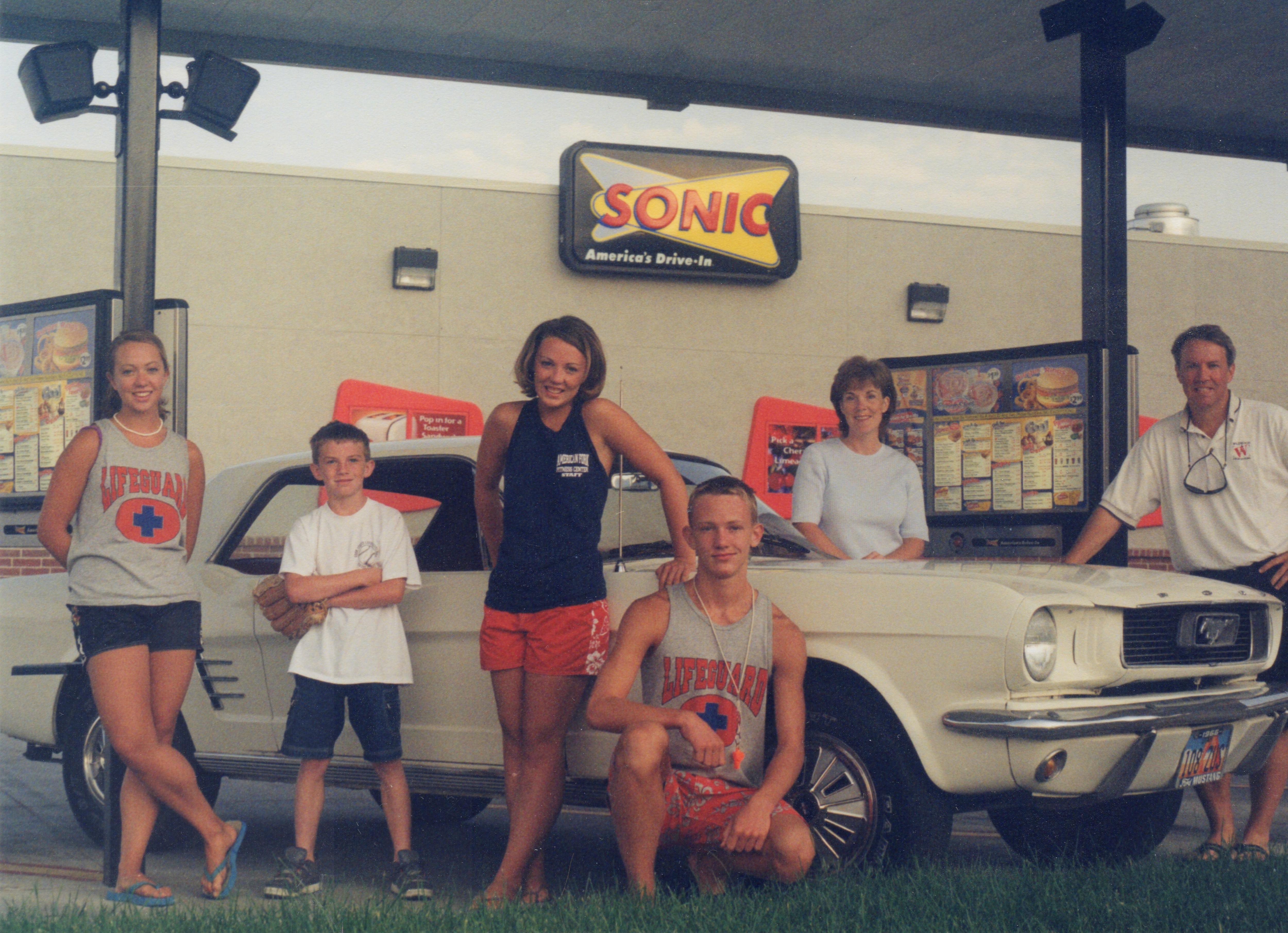 The family Mustang is at the center of each family photo from 1998 to 2025.