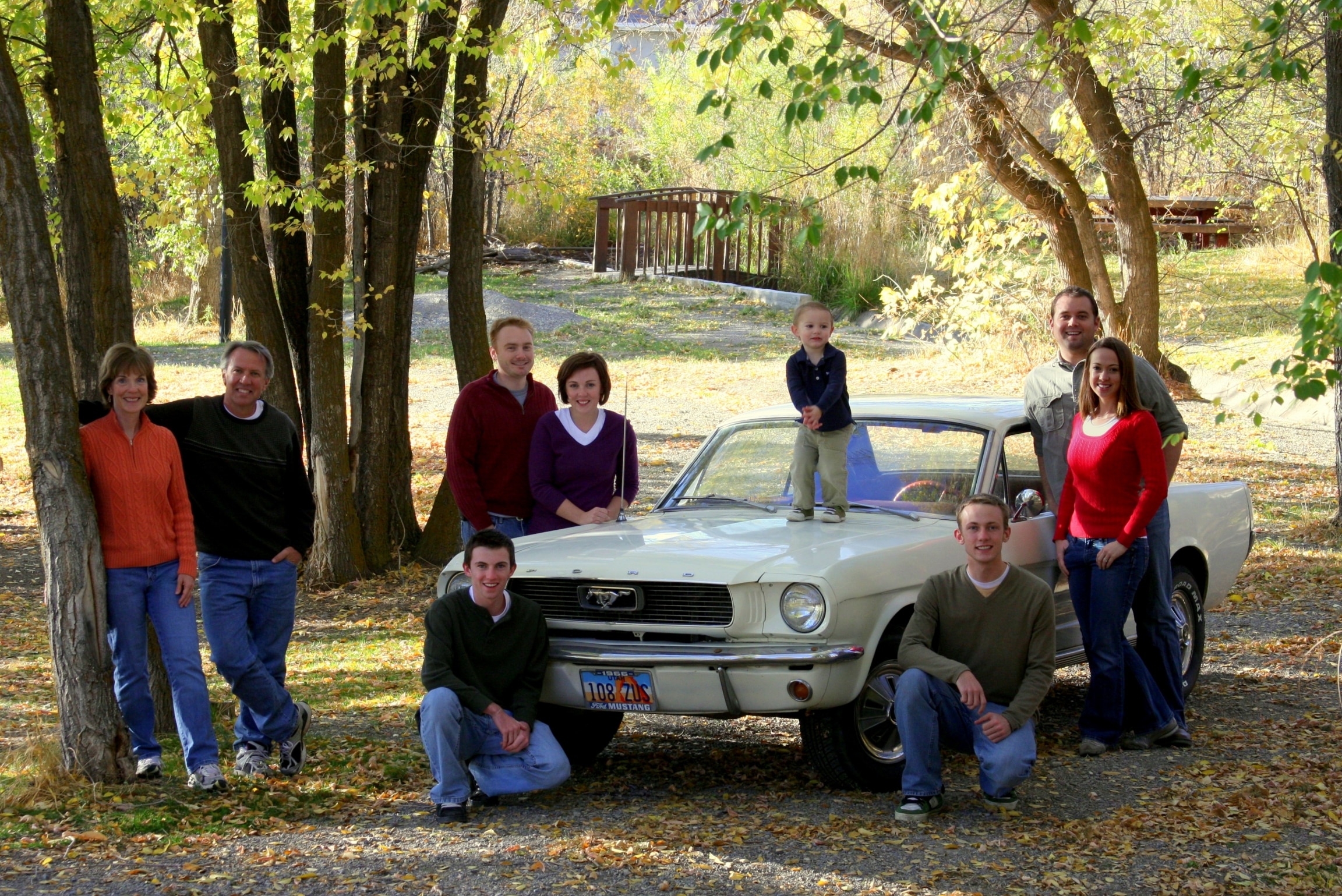 The family Mustang is at the center of each family photo from 1998 to 2025.