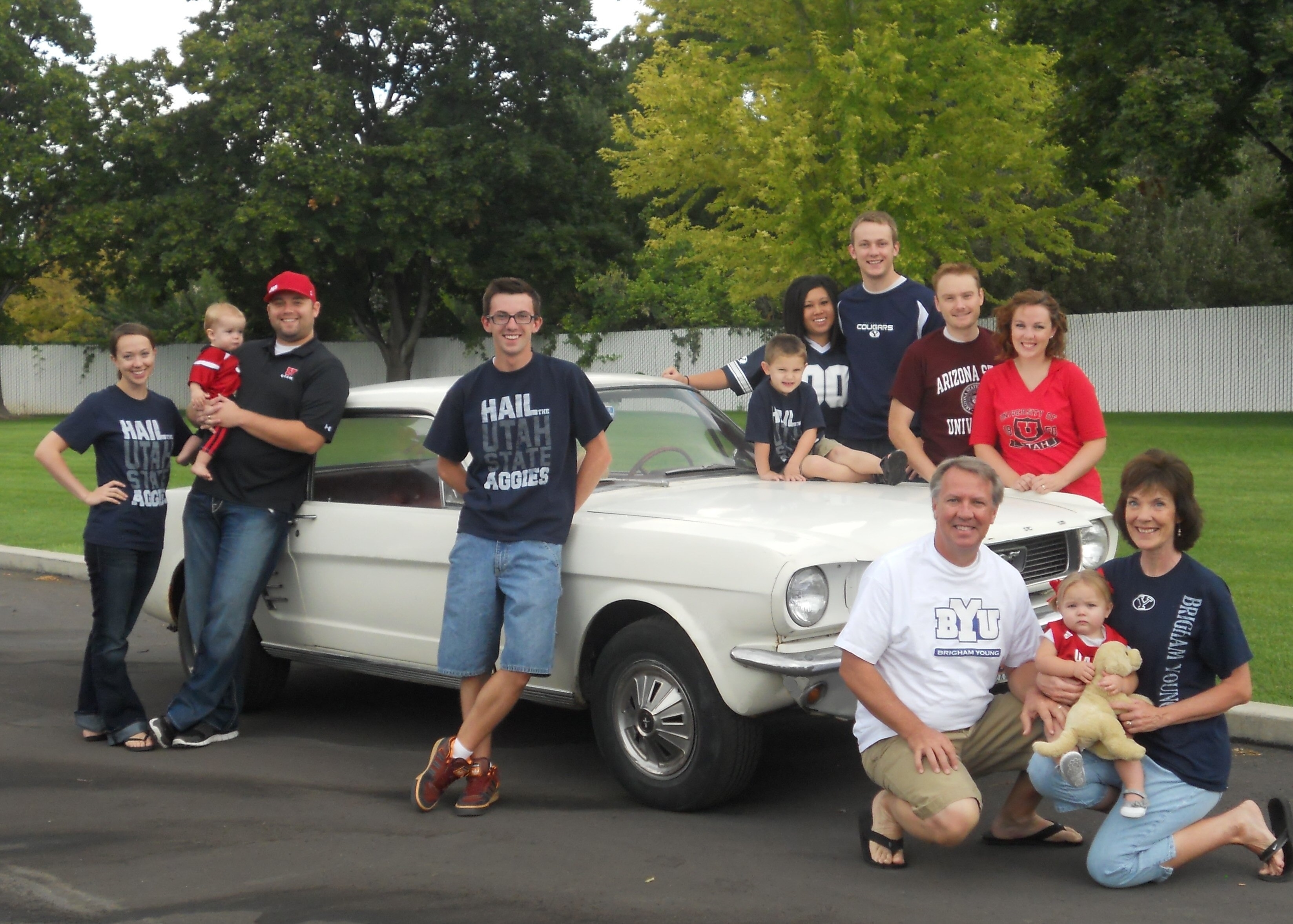 The family Mustang is at the center of each family photo from 1998 to 2025.
