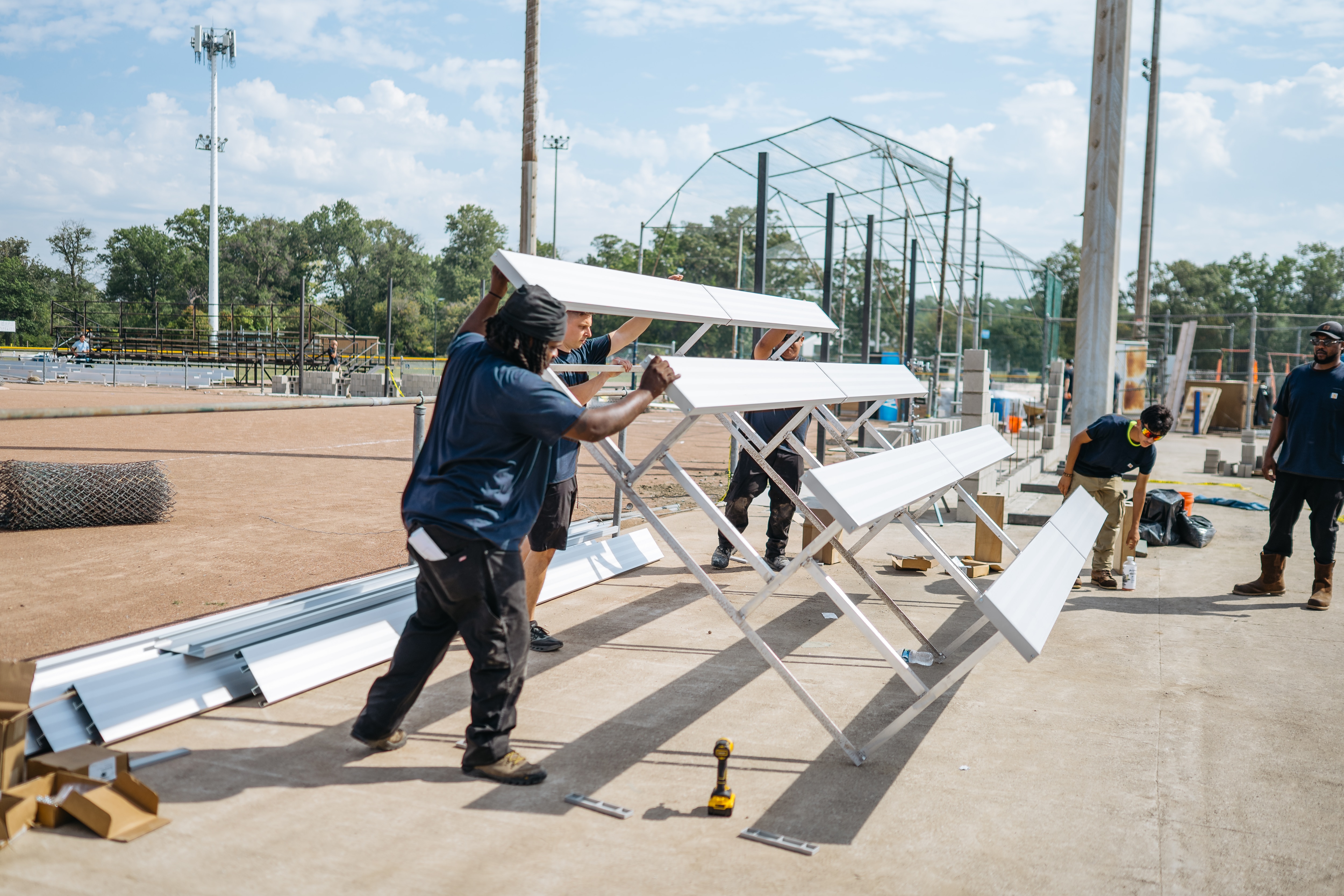 Volunteers from Ford and Carhartt built new bleachers.