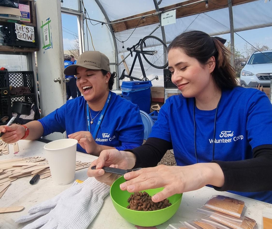 Employees prepared 2,000 seed packets in support of building a food sovereign city.