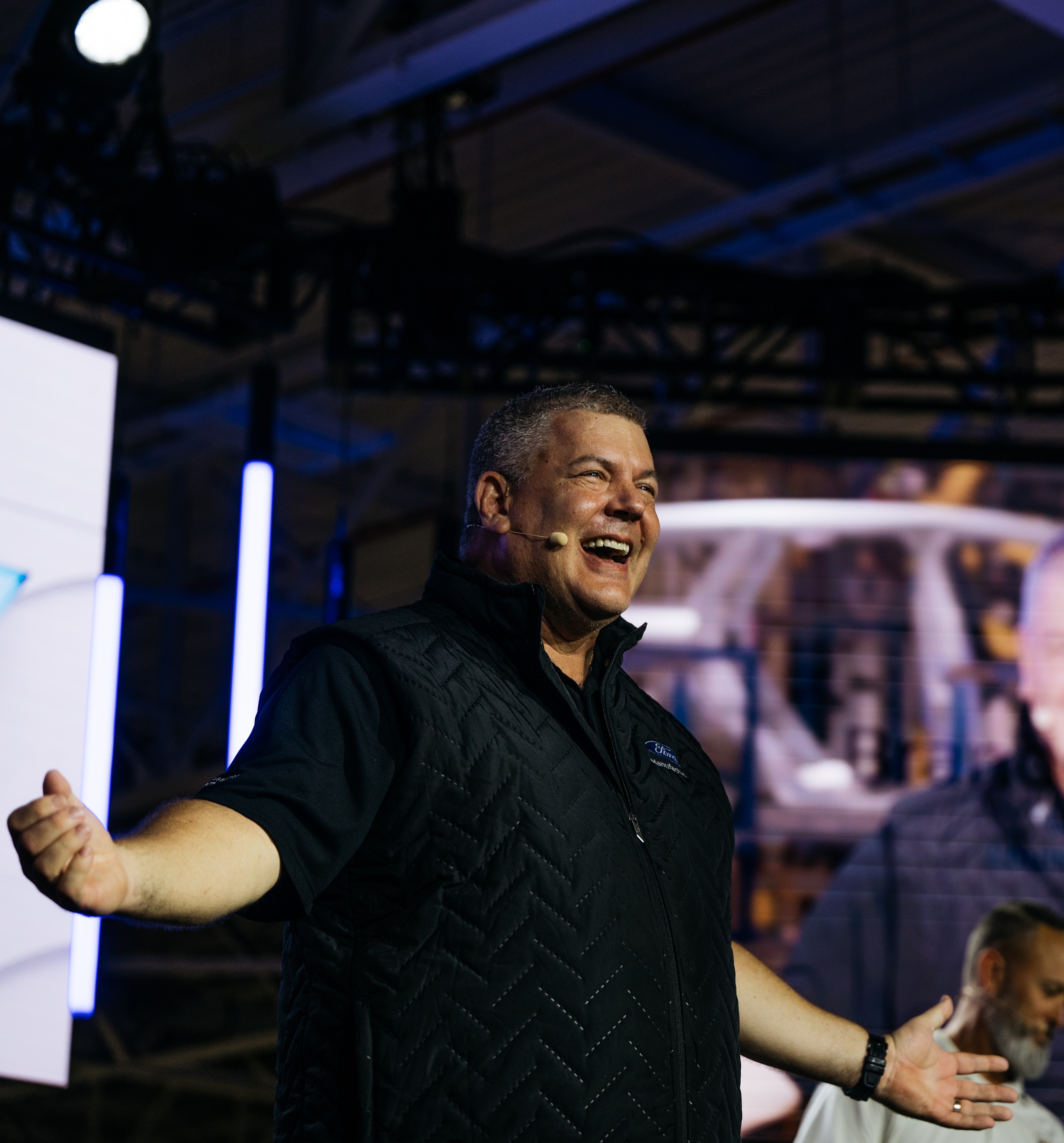 Bryce Currie, Ford vice president, Americas Manufacturing speaks during Monday’s launch event to introduce the new Ford Universal EV Platform and Ford Universal EV Production System at Louisville Assembly Plant on August 11, 2025. Louisville Assembly Plant will assemble the platform’s first vehicle – a midsize four-door electric pickup.