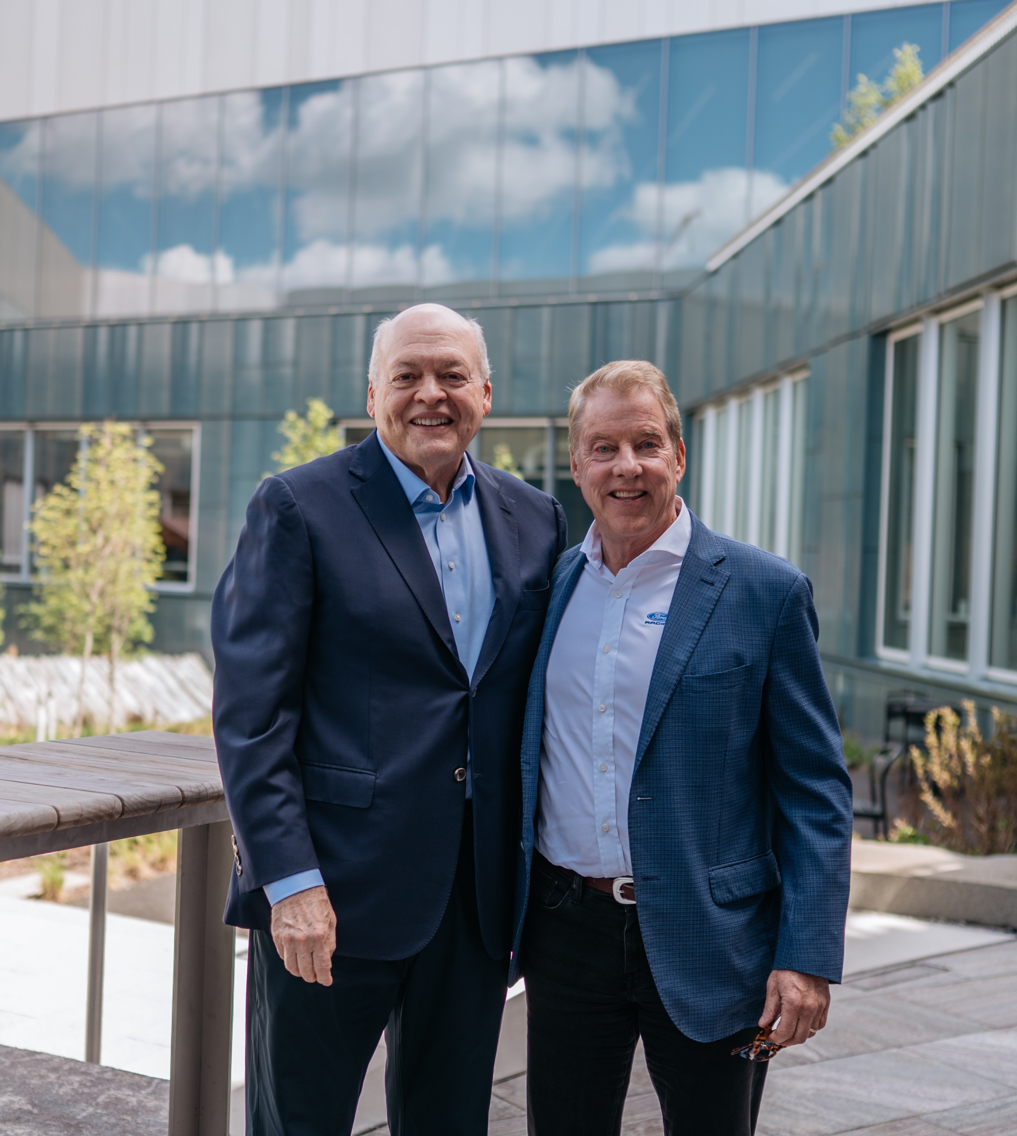 Jim Hackett’s (left) “Design Thinking” philosophy lives on in the design of Ford’s products and workspaces. Pictured here with Bill Ford in the Great Lakes Courtyard. (right).