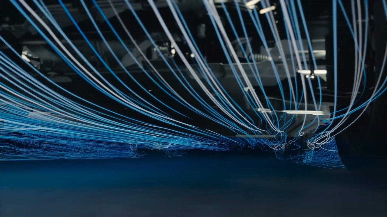 We streamlined the underbody to manage the air. Starting at the front, we made the bolt holes shallower and carefully directed the air around the tire and suspension.