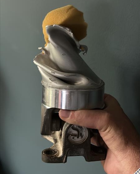 A twisted drive shaft demonstrates the extreme torque and mechanical stress endured.